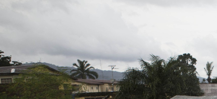 Healthcare workers in Sierra Leone spray disinfectant to prevent the spread of the Ebola virus in Kenema, on September 24, 2014. 