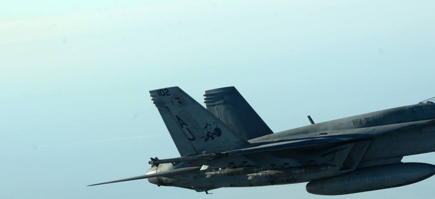 A formation of U.S. Navy F-18s leaves after receiving fuel from a KC-135 Stratotanker over northern Iraq, on September 23, 2014.