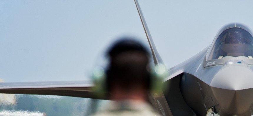An Air Force F-35 approaches an airman at Eglin Air Force Base, on July 14, 2011. 
