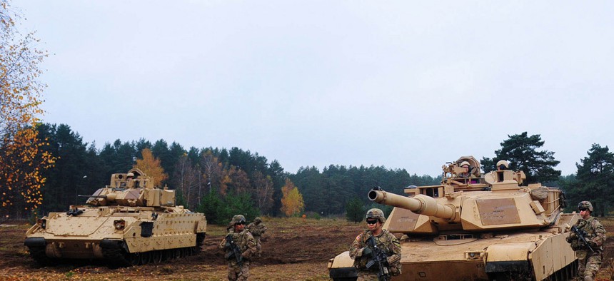 Soldiers assigned to the 1st Brigade Combat Team from Ft. Hood, Texas, demonstrate the capabilities of their vehicles at Military Base Adazi, Latvia. 