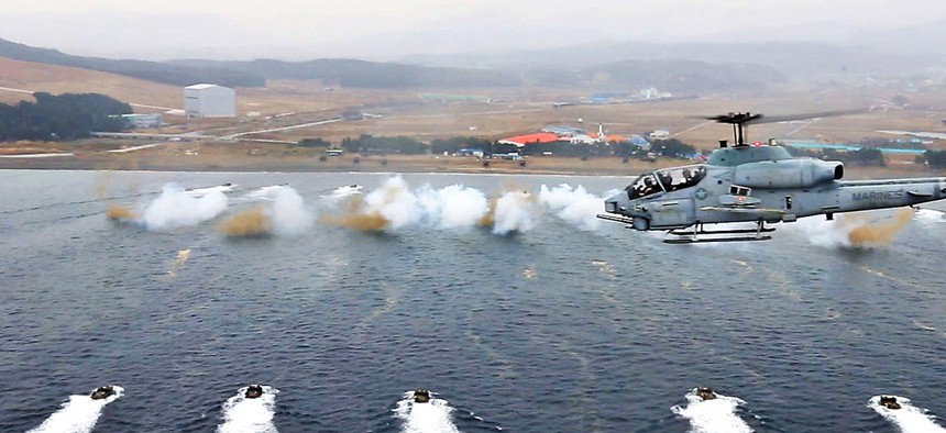 Troops from the Republic of Korea Marines and the 7th Marine Regiment participate in a mock amphibious landing during exercise Ssang Yong, on March 29, 2014.