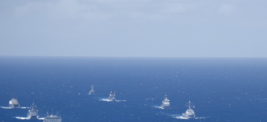 Ships and submarines participating in the 2012 Rim of the Pacific exercise stay in close formation during one part of the exercise. 