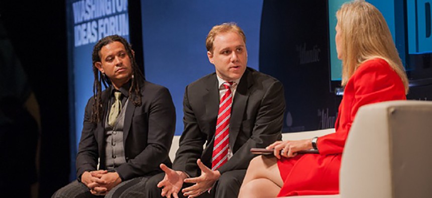 Morgan Marquis-Boire, the director of security at First Look Media, at left, and  Dmitri Alperovitch, CTO and co-founder at Crowdstrike, center, speak with The Atlantic's Mary Louise Kelly at the Washington Ideas Forum, Oct. 30, 2014.