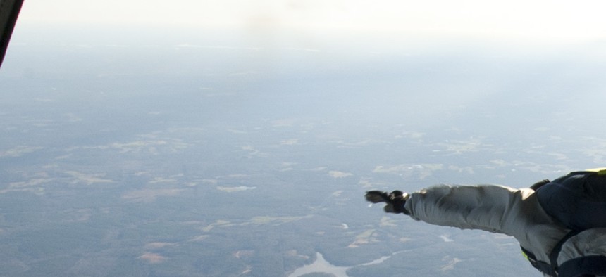 U.S. Navy SEALs exit a C-130 Hercules aircraft during a training exercise near Fort Pickett, Va.