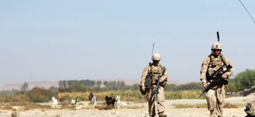 Marines with the 7th Marine Regiment patrol near FOB Musa Qala, Helmand province, on October 19, 2013.
