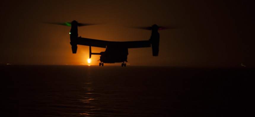 A MV-22 Osprey prepares to land aboard the amphibious assault ship USS Makin Island during night vision device flight operations on Sept. 17.