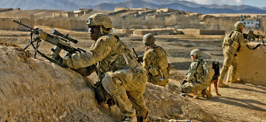 A soldier with the 10th Mountain Division provides security for ANSF troops in Kharwar District, on January 15, 2014. 