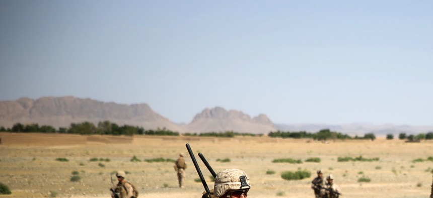 Cpl. Isaac Garcia patrols during a two-day mission in Larr Village, Afghanistan, May 22, 2014. 
