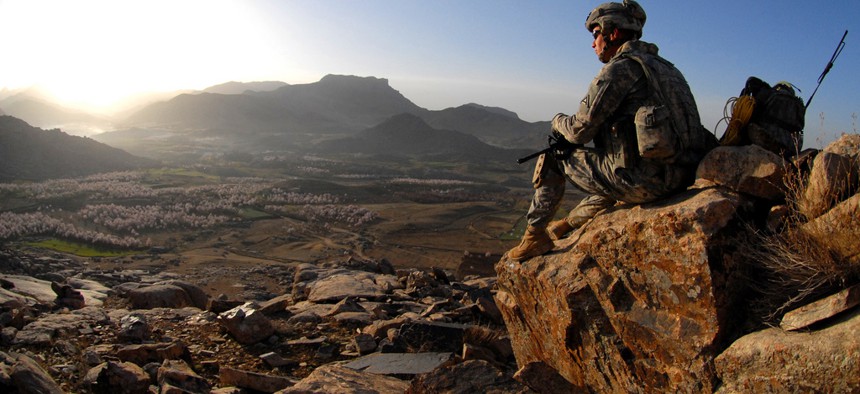 An Army sergeant watches the sunrise after a dismounted patrol mission near Forward Operating Base Baylough, Zabul, Afghanistan, March 19, 2009.