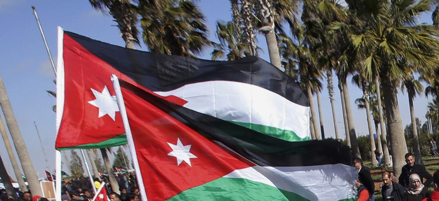 Jordanians gather to show their support for the government against terrorism as they await the arrival of King Abdullah II, on February 4, 2015.