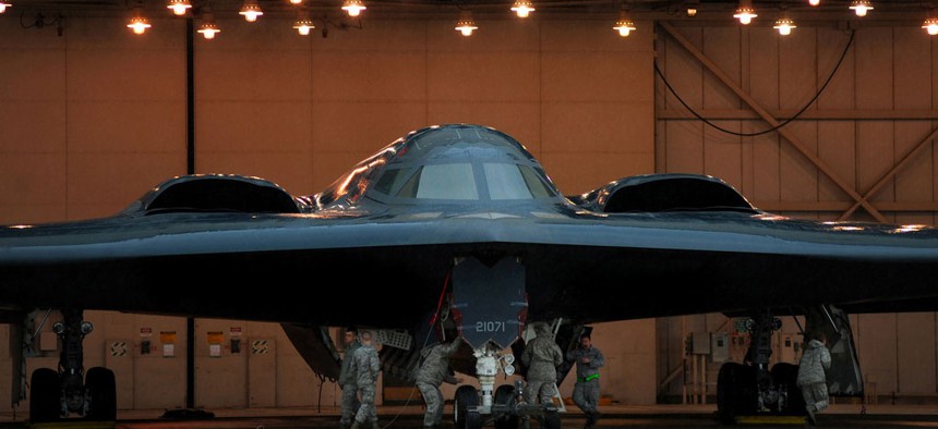 U.S. Air Force crew chiefs and other maintainers from the 509th Aircraft Maintenance Squadron prepare U.S. Air Force B-2 Spirit stealth bombers at Whiteman Air Force Base. Mo., March 19, 2011.