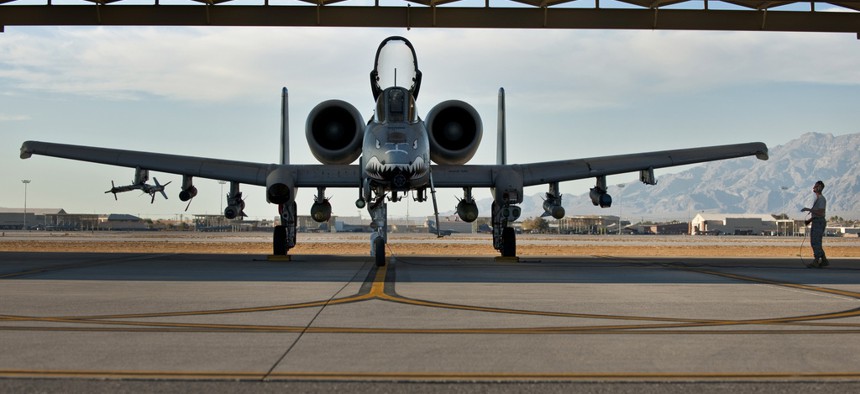 An Air Force NCO with the 23rd Aircraft Maintenance Squadron from Moody Air Force Base, Ga., conducts pre-flight checks on an A-10 Thunderbolt II before a training mission at Green Flag West 11-2 exercise at Nellis Air Force Base, on Dec. 6, 2010.