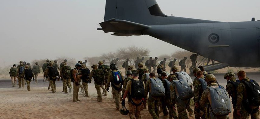 A multinational force of free fall parachutists board a Canadian C-130 for a jump wing exchange in Mao, Chad, Feb. 28, 2015, during Exercise Flintlock 2015.