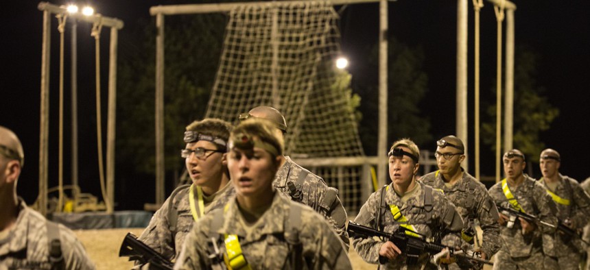Soldiers cool down after a two-mile run with their assigned weapons, before participating in an obstacle course on Fort Benning, Ga., Feb. 7, 2015.