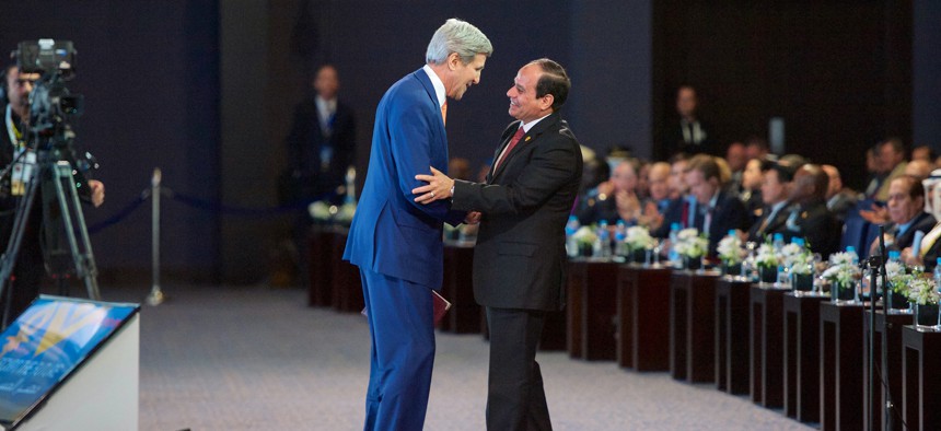 Egyptian president al-Sisi thanks Secretary of State John Kerry after an address at Sharm el-Sheik, on March 13, 2015.