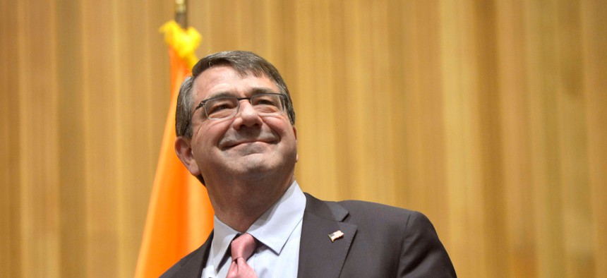 Defense Secretary Ash Carter greets the audience before participating in a roundtable discussion with members of the Institute for Veterans and Military Families at Syracuse University in Syracuse, N.Y., March 31, 2015. 