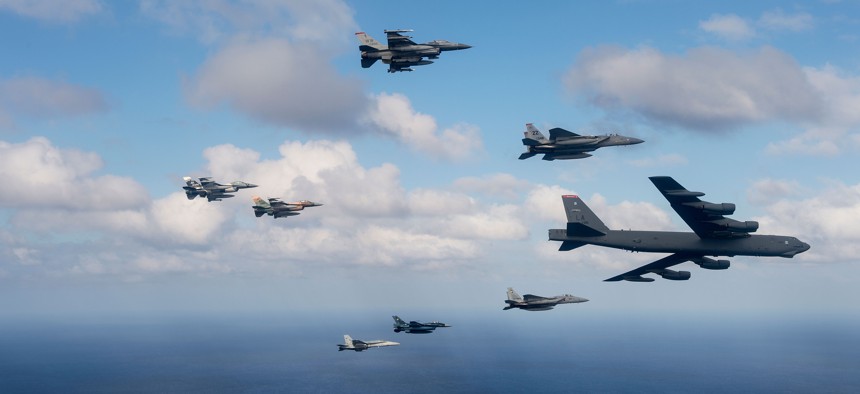 U.S. Air Force, Japan Air Self-Defense Force and Royal Australian Air Force aircraft fly in formation off the coast of Guam during Cope North 15, Feb. 17, 2015. 
