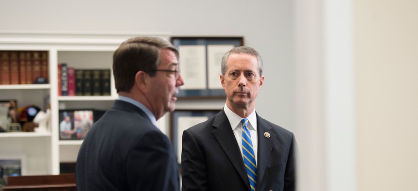 Defense Secretary Ashton Carter talks with House Armed Services Committee Chairman Rep. Mac Thornberry (R-TX) before testifying before the House Armed Services Committee in Washington. March. 18, 2015. 