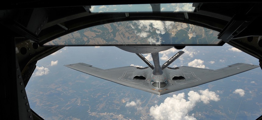 A KC-135 Stratotanker from the 22nd Air Refueling Wing refuels a B-2 Spirit from the 509th Bomb Wing, July 12, 2012. 