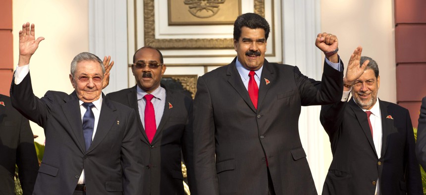 Cuba's President Raul Castro, Prime Minister of Antigua and Barbuda Gaston Browne, Venezuela's President Nicolas Maduro, and Saint Vincent and the Grenadines Prime Minister Ralph Gonsalves pose for a group photo on March 17, 2015.