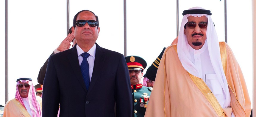 Saudi King Salman, right, stands with Egyptian President Abdel-Fattah el-Sissi during his arrival ceremony at Riyadh Airbase, Riyadh, Saudi Arabia, on March 1, 2015.