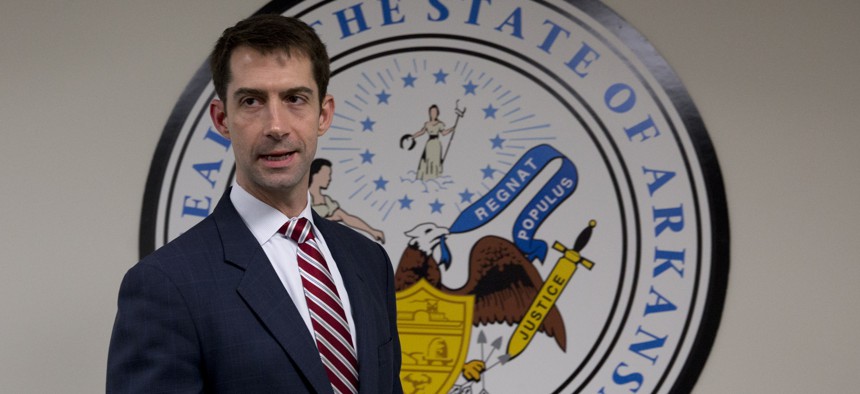 Sen. Tom Cotton, R-Ark. arrives to pose for photographers in his office on Capitol Hill in Washington, Wednesday, March 11, 2015.