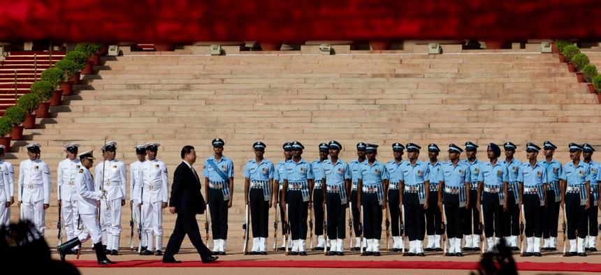 Chinese President Xi Jinping inspects a guard of honor during a ceremonial reception in New Delhi, India, Sept. 18, 2014. 