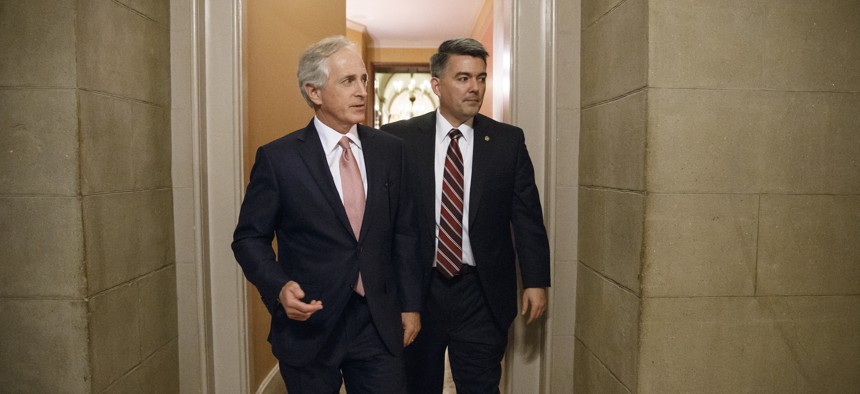 Senate Foreign Relations Committee Chairman Bob Corker, R-Tenn., left, and Sen. Cory Gardner, R-Colo., walk through a corridor at the Capitol after a closed-door meeting on Capitol Hill. 