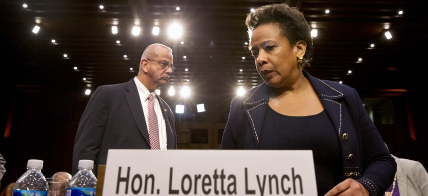 Attorney general nominee Loretta Lynch returns to Capitol Hill in Washington, Wednesday, Jan. 28, 2015, after a short break for her confirmation hearing before the Senate Judiciary Committee. 