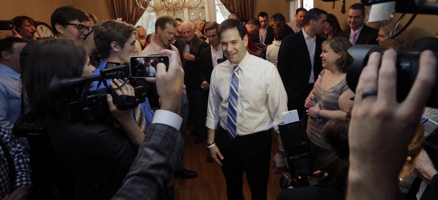 Republican presidential candidate, Sen. Marco Rubio, R-Fla., mingles with potential voters at a campaign house party, Friday, April 17, 2015, in Manchester, N.H. 
