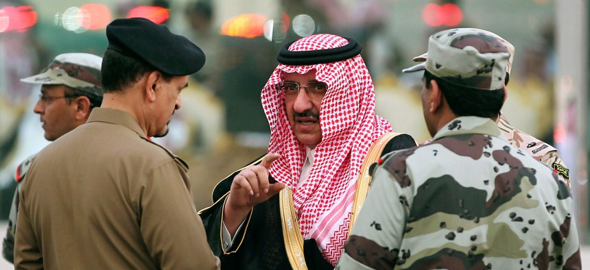 Prince Mohammed bin Nayef bin Abdul Aziz, Saudi Deputy Interior Minister at the time, speaks with Saudi officials while he attends a martial parade of Saudi armed forces outside Mecca in October 2012.