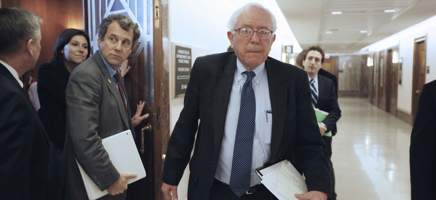 Sen. Bernard Sanders, I-Vt., right, and Sen. Sherrod Brown, D-Ohio, emerge from a closed meeting of the Social Security caucus, Thursday, Jan. 27, 2011.