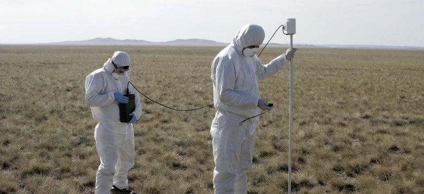 In this Sept. 15, 2008 file photo, experts take measurements during an exercise at the former nuclear test site of Semipalatinsk, northeastern Kazakhstan. 