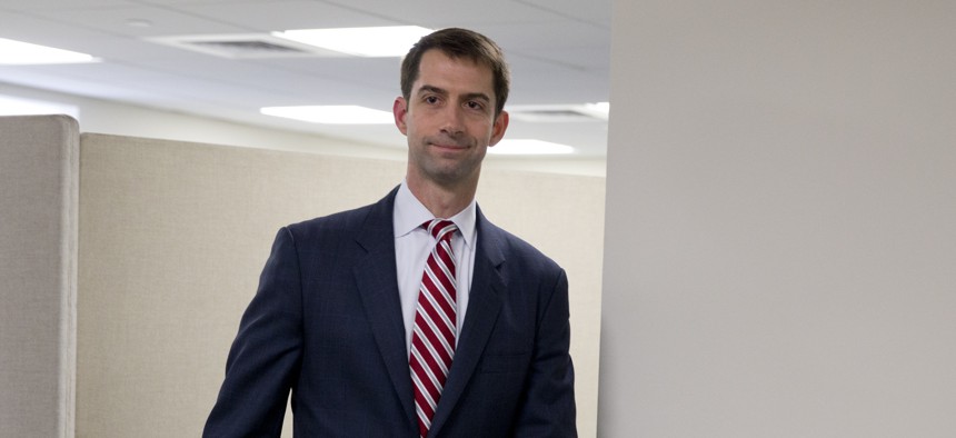 Sen. Tom Cotton, R-Ark. arrives to pose for photographers in his office on Capitol Hill in Washington, Wednesday, March 11, 2015. 