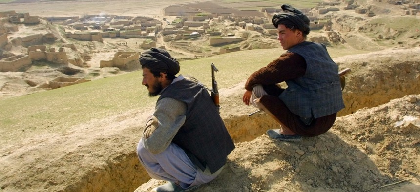 Afghan militiamen, Gen. Rashid Dostum-aligned fighters, are on guard on a hill over Karnai village, 80 kilometers (50 miles) south of Mazar-e- Sharif, Thursday, Jan. 31, 2002.