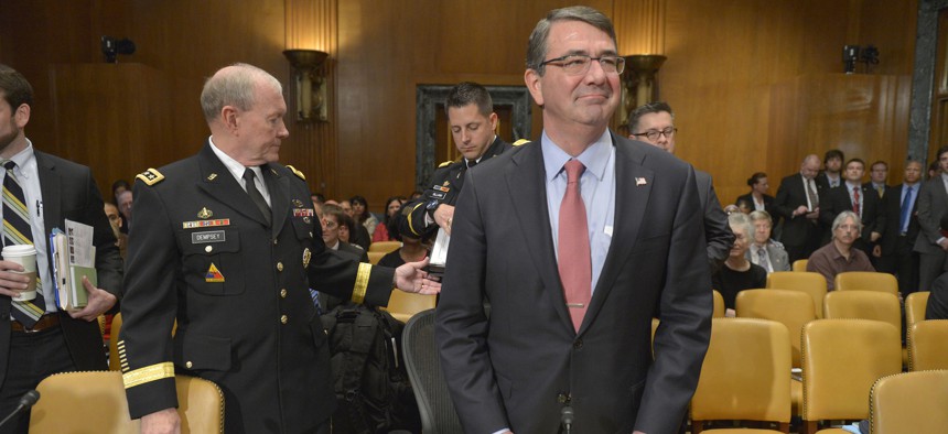 Secretary of Defense Ash Carter glances around the room as he and Chairman of the Joint Chiefs of Staff Army Gen. Martin Dempsey prepare to testify before the Senate Appropriations Committee's defense subcommittee, in Washington, D.C., May 6, 2015. 