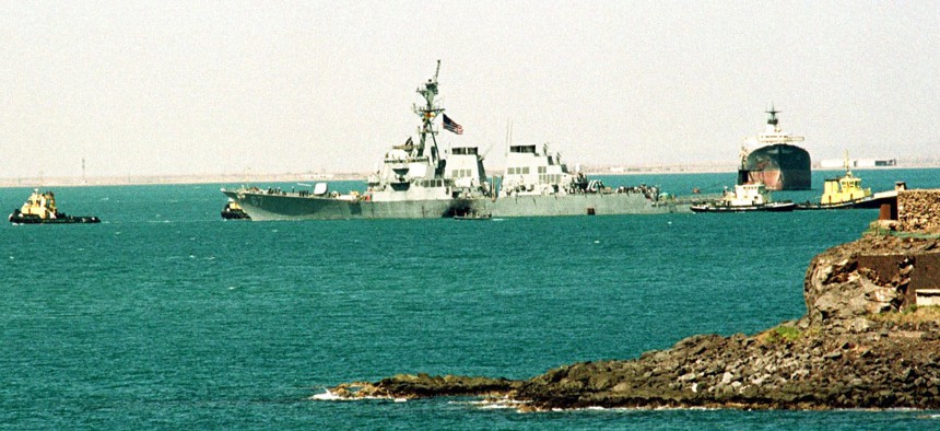 The crippled USS Cole is towed into deep water by Yemini tug boats from the port of Aden, Sunday Oct. 29, 2000.