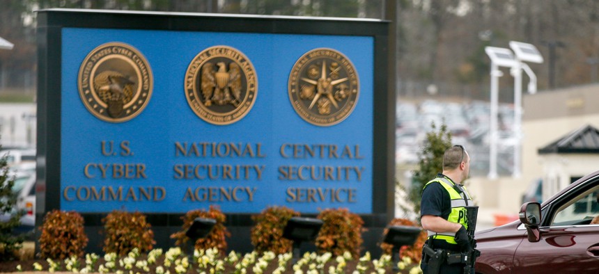 A police officer directs a vehicle to turn away at the National Security Agency, Monday, March 30, 2015, in Fort Meade, Md. 