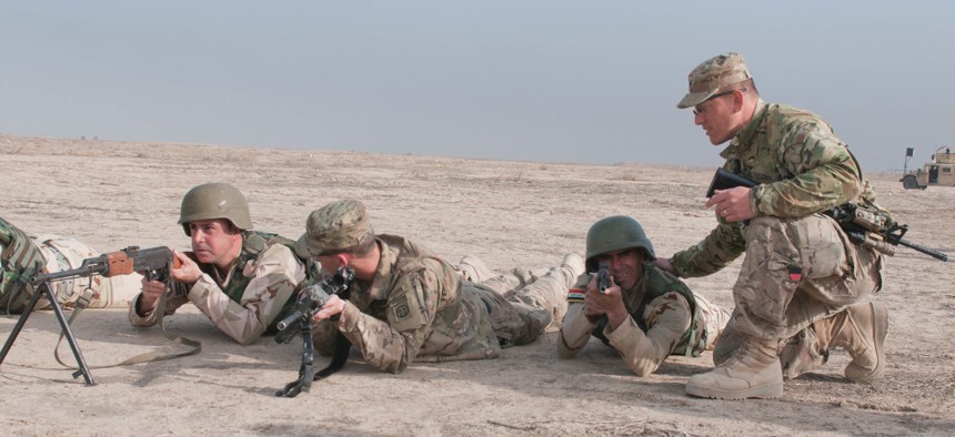 U.S. soldiers instruct Iraqi security forces on defensive tactics at Besmaya Range Complex, Iraq, on March 26. 