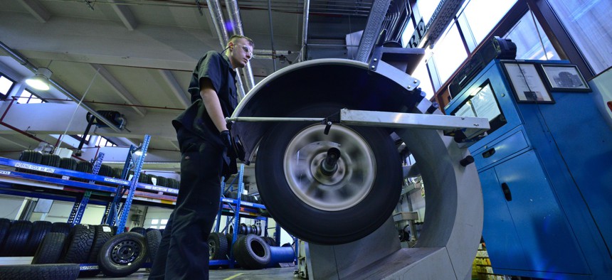An Airman checks the pressure on a tires at Ramstein Air Base, Germany, on Jan. 14, 2015.
