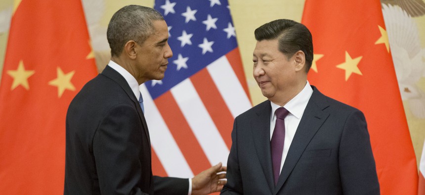 U.S. President Barack Obama, left, and Chinese President Xi Jinping shake hands following the conclusion of their joint news conference at the Great Hall of the People in Beijing, Wednesday, Nov. 12, 2014.