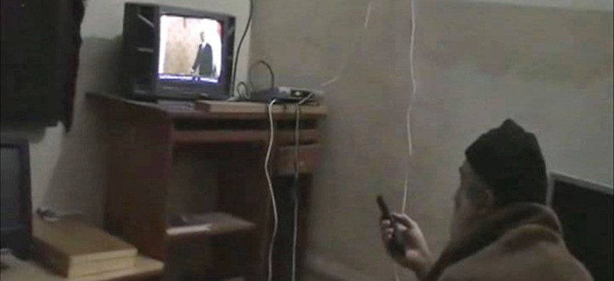 This undated image from video seized from the walled compound of al-Qaida leader Osama bin Laden in Abbottabad, Pakistan and released by the U.S. Department of Defense shows a man identified by the U.S. government as Osama Bin Laden in front of a TV.