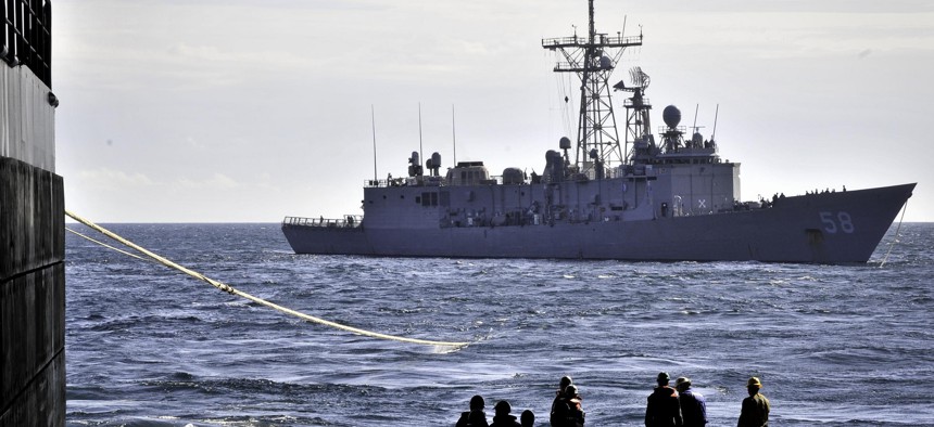 The Oliver Hazard Perry-class guided-missile frigate USS Samuel B. Roberts (FFG 58) conducts a towing exercise with the amphibious transport dock ship USS New York (LPD 21).