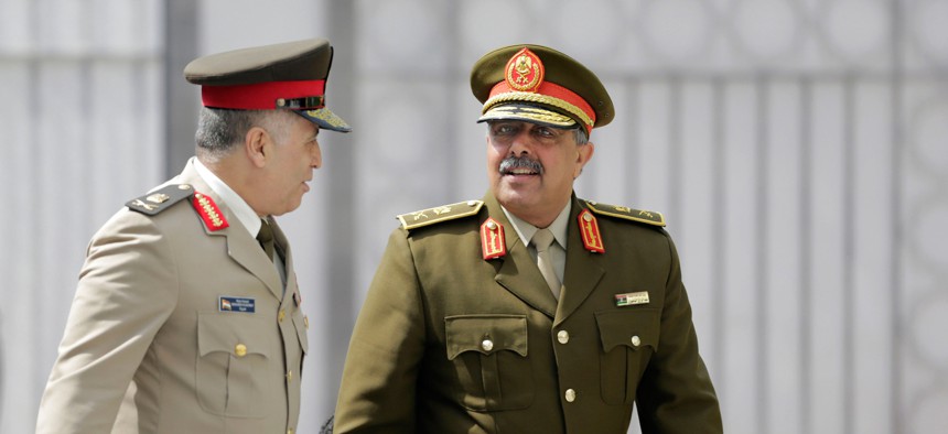 Lt. Gen. Abdel Razek Al-Nazori, Chief of Staff of the Libyan Armed Forces, right, is accompanied by Egyptian Major General, Mohammed Al Kishky, as they arrive at an Arab military chiefs meeting at the Arab League headquarters, in Cairo, Egypt, in April.