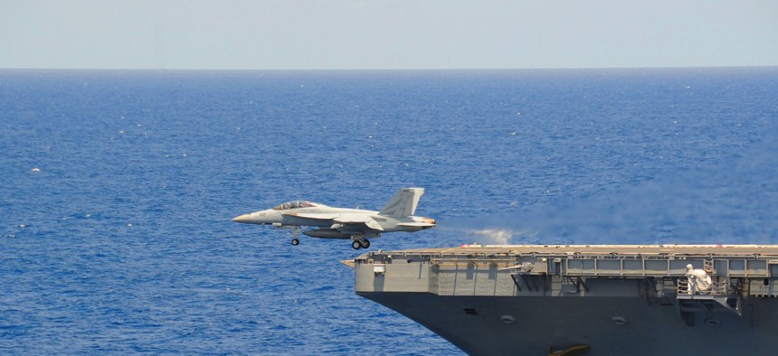An F/A-18 Super Hornet assigned to the Black Knights of Fighter Attack Squadron (VFA) 154 is launched from the flight deck of the aircraft carrier USS Ronald Reagan (CVN 76). 