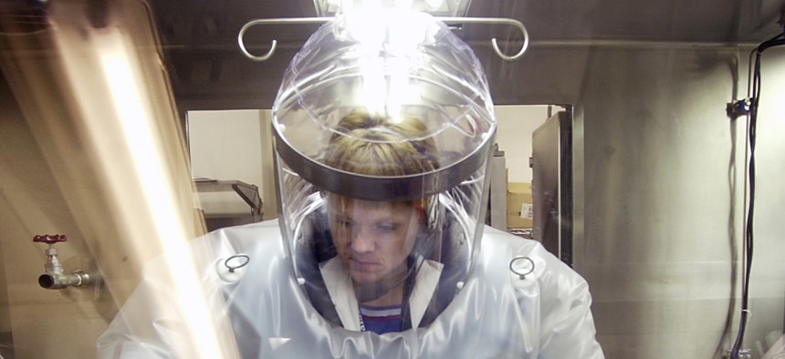 May 11, 2003, Microbiologist Ruth Bryan works with BG nerve agent simulant in Class III Glove Box in the Life Sciences Test Facility at Dugway Proving Ground, Utah.
