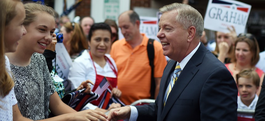 Sen. Lindsey Graham, R-S.C., greets supporters after announcing his bid for presidency, Monday, June 1, 2015.