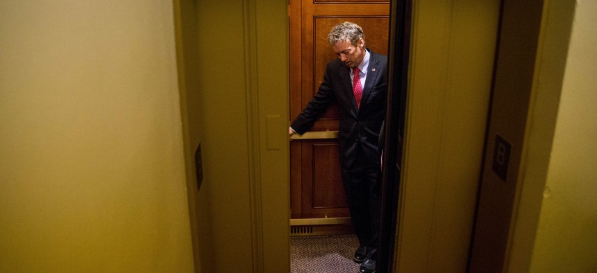 Republican presidential candidate, Sen. Rand Paul, R-Ky. departs in an elevator after speaking at a news conference on Capitol Hill in Washington, Tuesday, June 2, 2015.