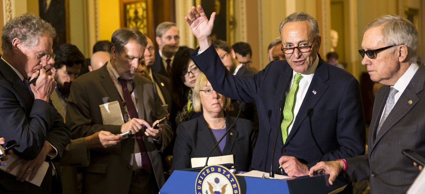 Sen. Charles Schumer, D-N.Y., flanked by Sen. Patty Murray, D-Wash., and Senate Minority Leader Harry Reid of Nev. speaks with reporters on Capitol Hill in Washington, Tuesday, May 5, 2015.