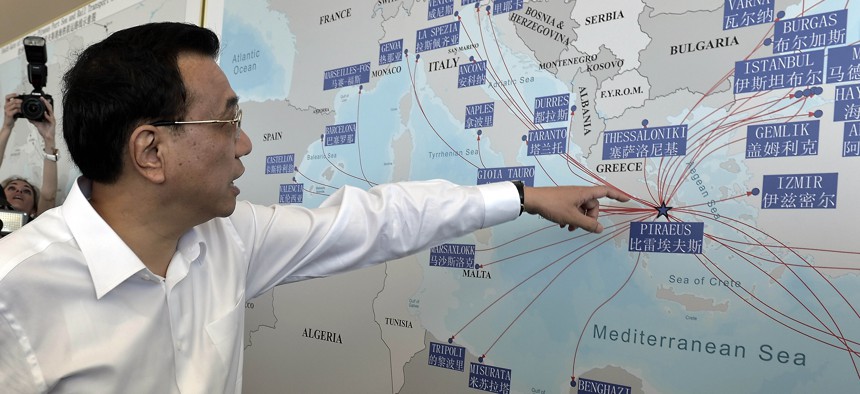 Chinese Prime Minister Li Keqiang looks at a map of the port of Piraeus, where Chinese shipping giant Cosco controls two of the three container terminals, on Friday June 20, 2014.